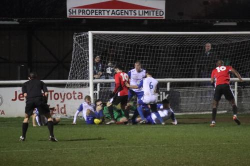 A late scramble in the Enfield goalmouth56