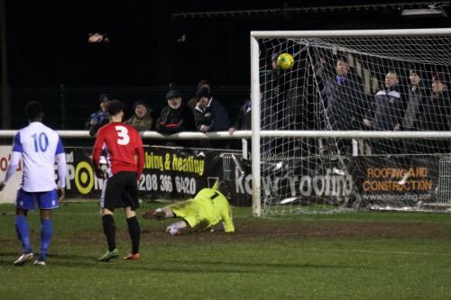 Burgess Hill keeper James Shaw is beaten but saved by the crossbar
