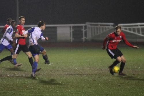 Burgess Hills James Richmond (R) blocks a shot from Mickey Parcell