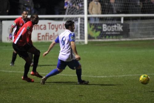 Burgess Hills Stephane Ngamvoulou (L) and Enfields Mario Noto