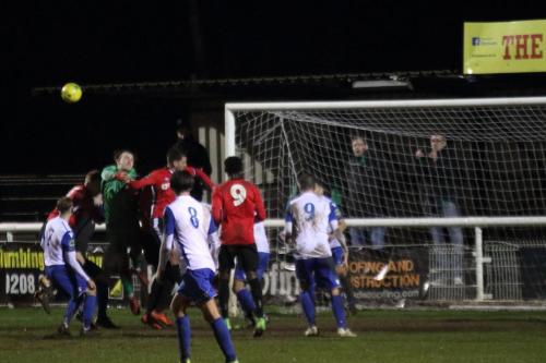 Enfield keeper Joe Wright punches clear