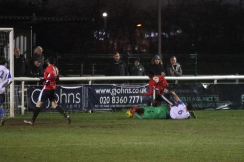 Enfields Joe Wright and Mario Noto (6) combine to close out Ibrahim Forfana