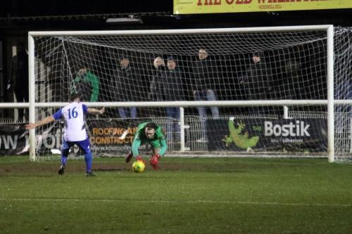 Enfields Joe Wright pounces on the ball after parrying a free kick as John Kyriacou covers