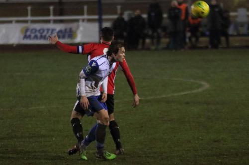 Enfields Mickey Parcell (white) heads clear from Jack Brivio