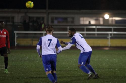 Enfields Taofiq Olomowewe (R) heads clear