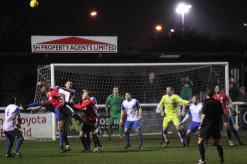 With Burgess Hill keeper James Shaw joining the attack, Enfields Taylor McKenzie beats Hafeez Sansui to the ball
