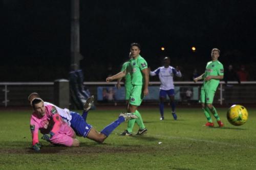 A cross from Enfields Ryan Blake (2nd R) beats everyone