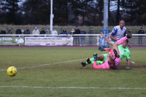 Dorking keeper Slavomir Huk and defender David Ray combuine to stop a cross reaching Simon Thomas