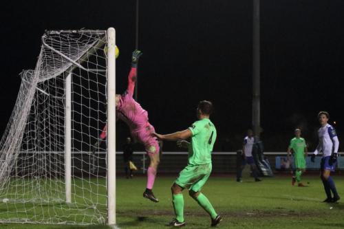 Dorking keeper Slavomir Huk is beaten by Ryan Blackmans cross shot for the winning goal