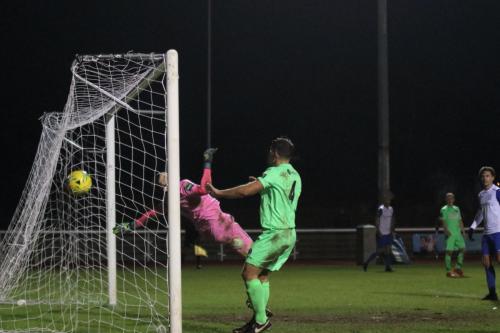 Dorking keeper Slavomir Huk is beaten by Ryan Blackmans cross shot for the winning goal74