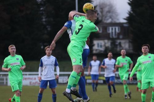 Dorkings Chris Boulter (3) challenges Simon Thomas