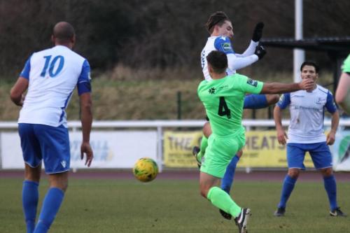 Dorkings David Ray (4) clears from Sam Youngs