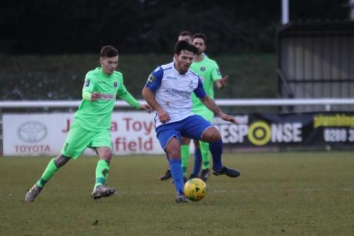 Dorkings James McShane (L) and Enfields Mario Noto