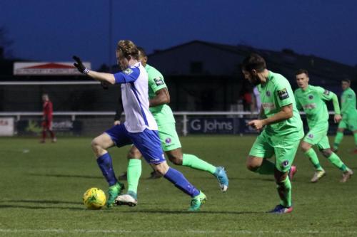 Enfields Aaron Greene breaks clear of Jerome Beckles and Dean Hamlin (R)