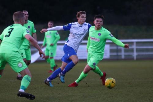Enfields Mickey Parcell (white) plays the ball past Dan Pearse (R)