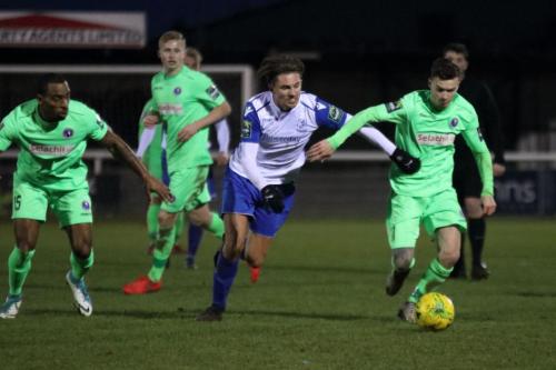Enfields Sam Youngs and Dorkings James McShane (R) tussle for possession