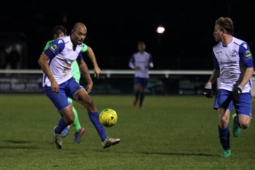 Enfields Simon Thomas (L) passes to Aaron Greene