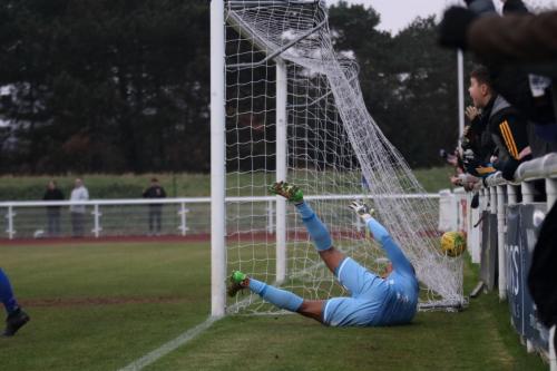 Dulwich keeper Preston Edwards cant stop his fumble entering the goal to give Enfield the lead