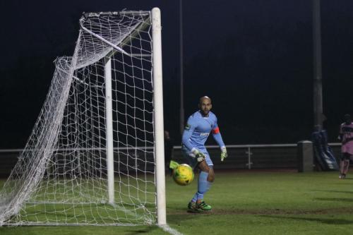 Dulwich keeper Preston Edwards watches a shot drift just wide