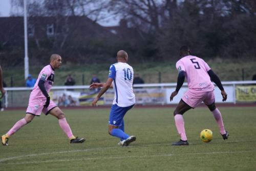 Dulwichs Ashley Carew (L) and Anthony Acheampong and Enfields Simon Thomas
