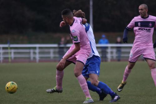 Dulwichs Quade Taylor (L) battles with Mickey Parcell as Ashley Carew looks on