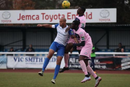 Enfields Simon Thomas and Dulwichs Anthony Acheampong (rear) and Michael Onuvwigun