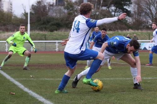 Enfields Aaron Greene (white) and Lowestofts Rory McAuley