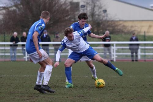 Enfields Aaron Greene and Lowestofts Dan Humphreys (L) and Harvey Hodd