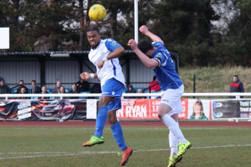 Enfields Dernell Wynter (L) heads over the bar