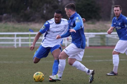 Enfields Dernell Wynter lines up a shot as Adam Smith tries to block