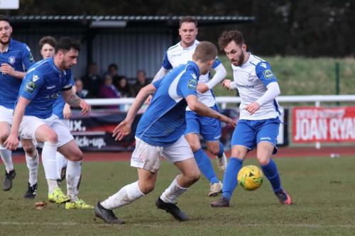 Enfields Jack Hockney (R) and Liam Hope and Lowestofts Travis Cole (L) and Dan Humphreys