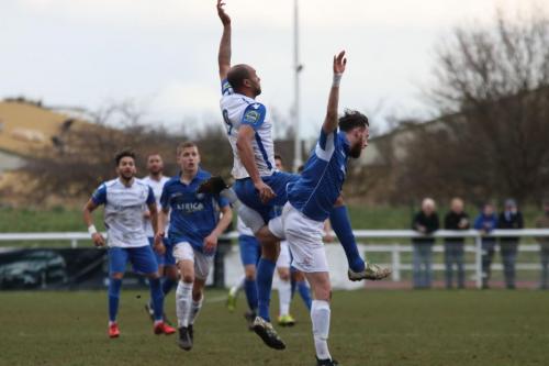 Enfields Simon Thomas (9) and Lowestofts Rory McAuley