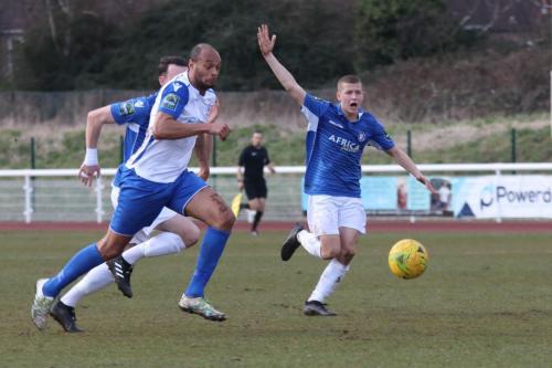 Enfields Simon Thomas breaks clear as Dan Humphreys appeals unsuccessfully for a free kick