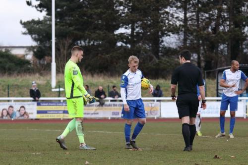 Lowestoft keeper Ben Dudzinski and Enfields Ryan Blackman discuss the award of a penalty for an off-the ball incident while the ball was near the corner flag