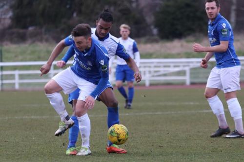 Lowestofts Adam Smith (L) and Enfields Dernell Wynter