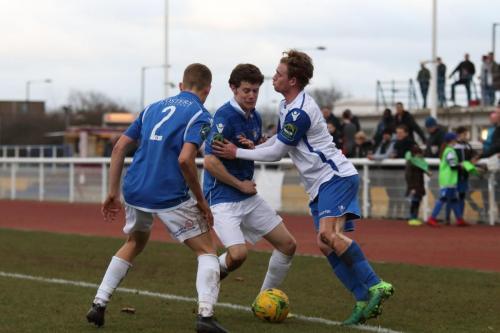 Lowestofts Dan Humphreys (2) and Harvey Hodd and Enfields Aaron Greene