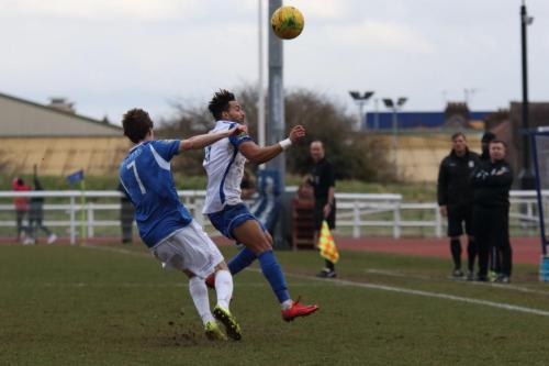 Lowestofts Harvey Hodd (L) and Enfields Tyler Campbell