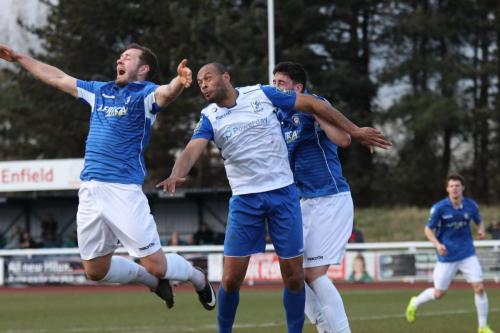 Lowestofts Jacek Zielonka (L) and Travis Cole and Enfields Simon Thomas