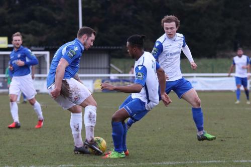 Lowestofts Jacek Zielonka (L) challenges Dernell Wynter