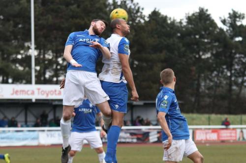 Lowestofts Rory McAuley (L) and Enfields Simon Thomas