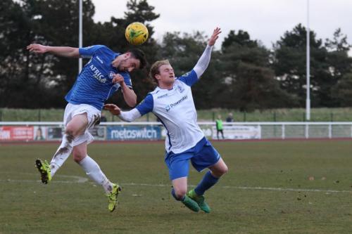 Lowestofts Travis Cole (L) and Enfields Aaron Greene