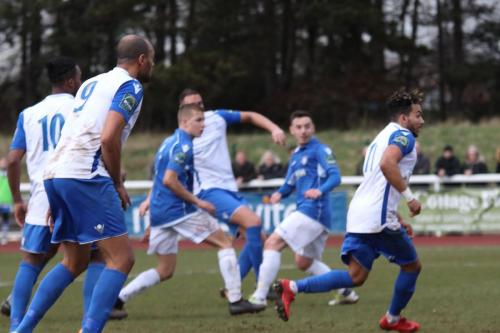 Mat Mitchel-King (white, centre) opens the scoring