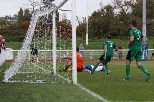 Phoenix keeper Steve Phillips saves from George Beattie