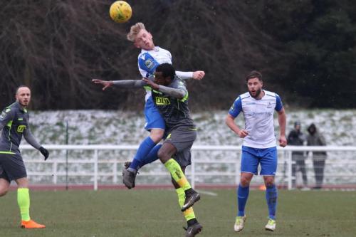 Enfields Ryan Blackman (white) challenges Wadah Ahmidi