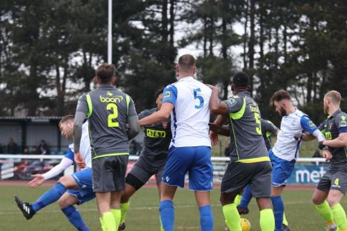 Jack Hockney (white, R) controls the ball before turning and scoring the first Enfield goal