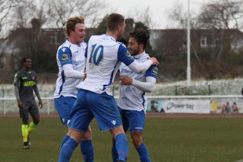 Scorer Tyler Campbell (R) celebrates the second Enfield goal with Aaron Greene (L) and Brad Wadkins