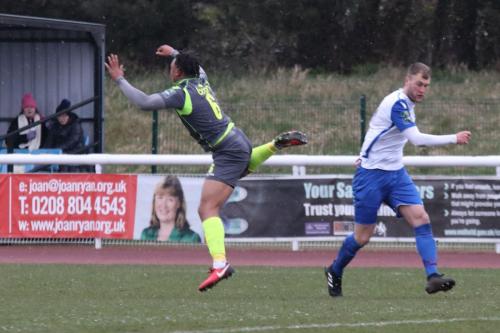 Staines Joash Nembhard (L) and Enfields Brad Wadkins