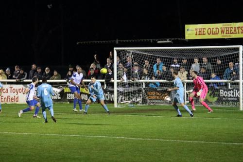 Enfields Elliot Benyon (far L) shoots narrowly wide