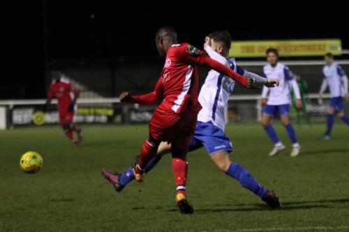 Chipsteads Jeremy Boakye (L) clears from Jack Hockney