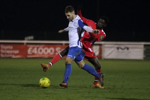 Chipsteads Jeremy Boakye (red) and Enfields Jack Hockney
